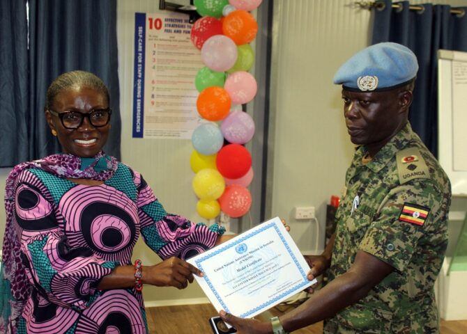Lt-Col-Peter-Magungu-R-Commander-UNGU-VIII-receiving-a-medal-and-certificate-from-Deputy-Special-Representative-of-the-Secretary-General-UNSOS-HE-Anita-Kiki-Gbeho-L-at-UNGU-City-Somalia-1